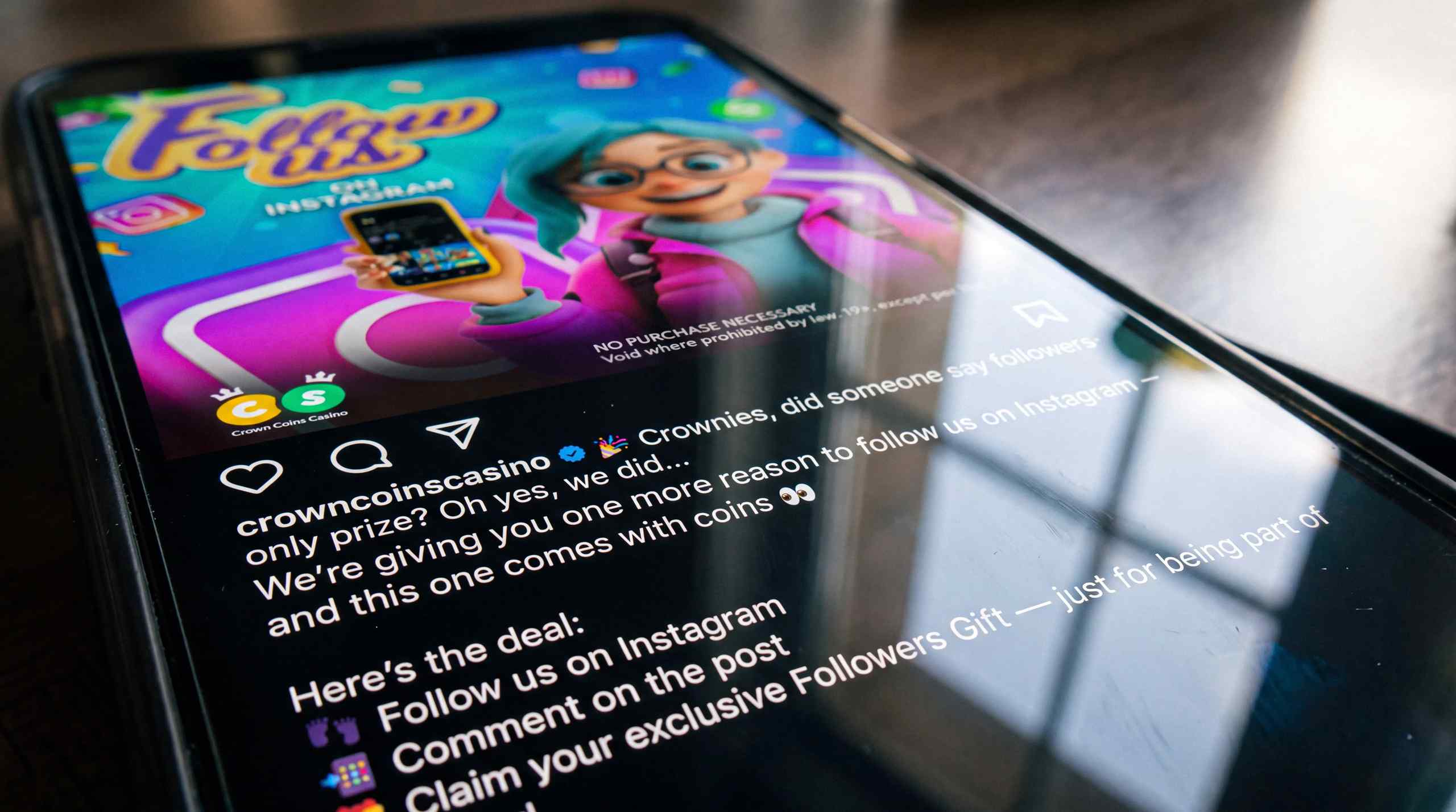 CrownCoins Casino social media promos displayed on a smart phone.
